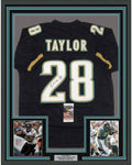 Framed Autographed/Signed Fred Taylor 35x39 Jacksonville Black Football Jersey JSA COA
