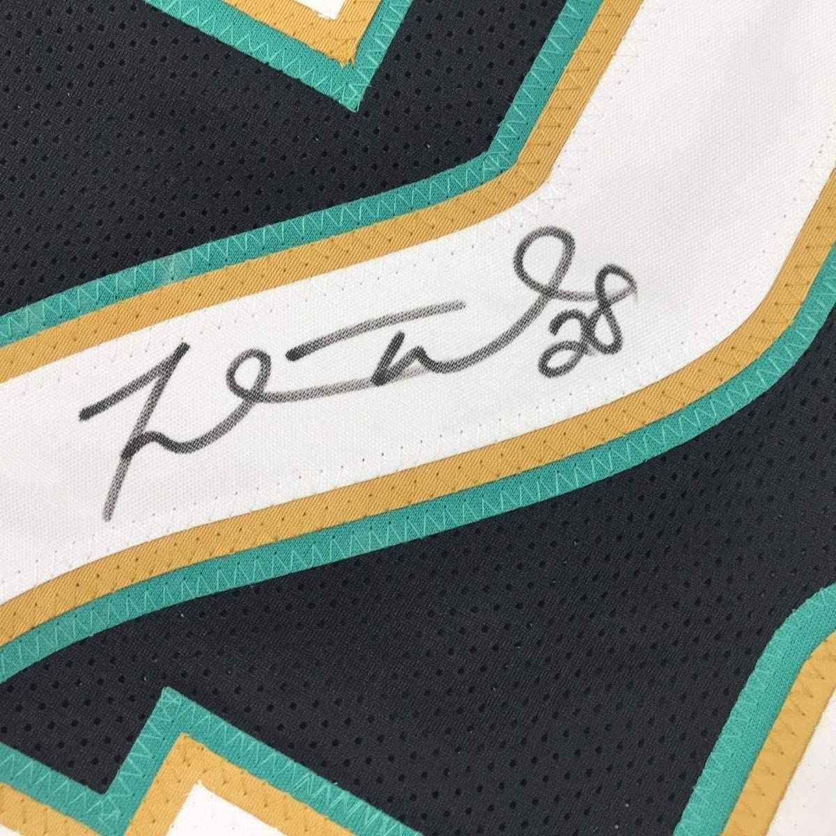 Framed Autographed/Signed Fred Taylor 35x39 Jacksonville Black Football Jersey JSA COA